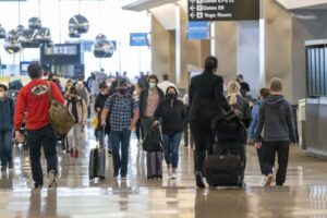 Americans splurge on travel, even as they cut back elsewhere.